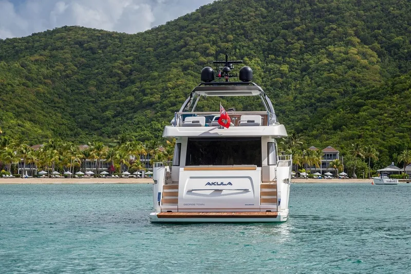 Squalo Yacht Photos Pics Sanlorenzo SL86 yacht, 2018 model, anchored in tropical waters with lush green hills.