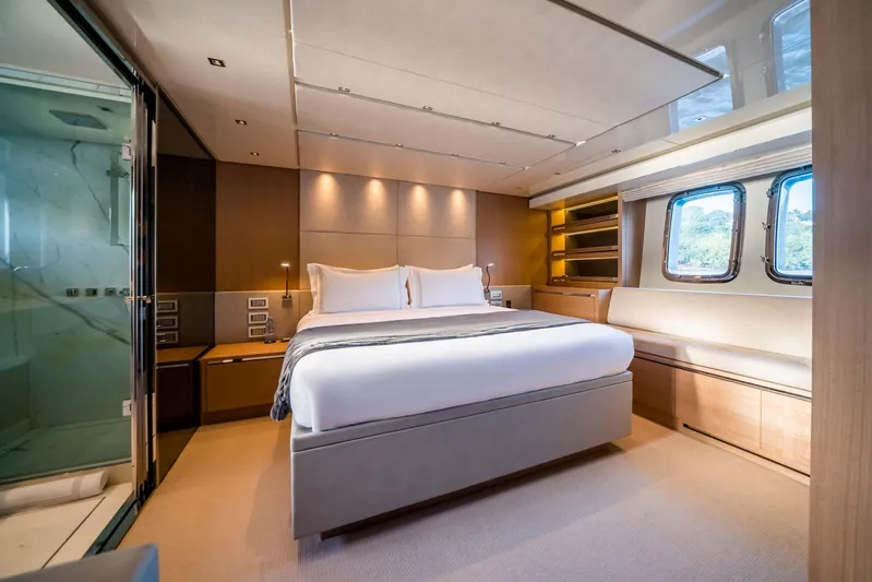 Squalo Yacht Photos Pics Luxurious bedroom interior of 2018 Sanlorenzo SL86 yacht with modern design and large windows.