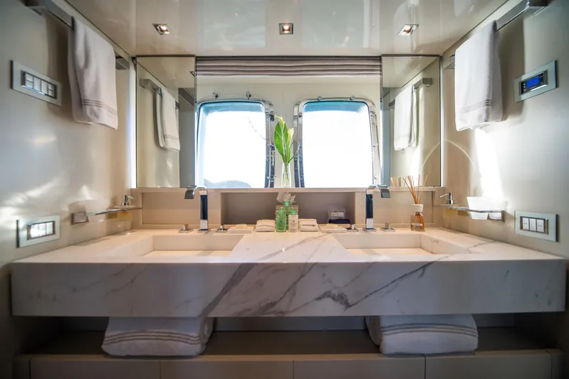 Squalo Yacht Photos Pics Luxurious bathroom on 2018 Sanlorenzo SL86 yacht with marble double sink and elegant fixtures.