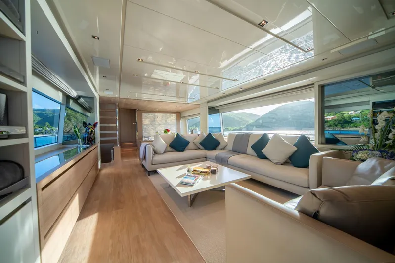 Squalo Yacht Photos Pics Luxurious interior of 2018 Sanlorenzo SL86 yacht with elegant seating and scenic views.