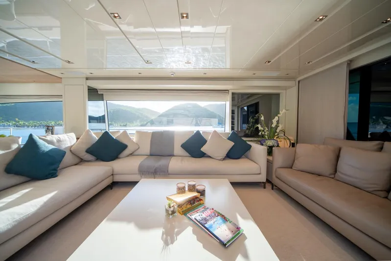 Squalo Yacht Photos Pics Luxurious interior of 2018 Sanlorenzo SL86 yacht with elegant seating and scenic views.