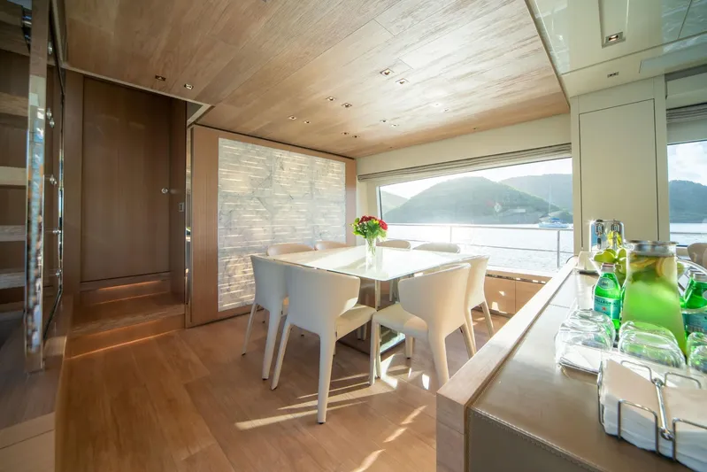 Squalo Yacht Photos Pics Luxurious interior of 2018 Sanlorenzo SL86 yacht with elegant dining area and scenic ocean view.