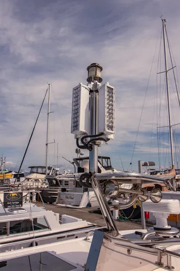 Arrow II Yacht Photos Pics Boat docked at marina with Aspen C107 equipment, 2019 model, under a partly cloudy sky.