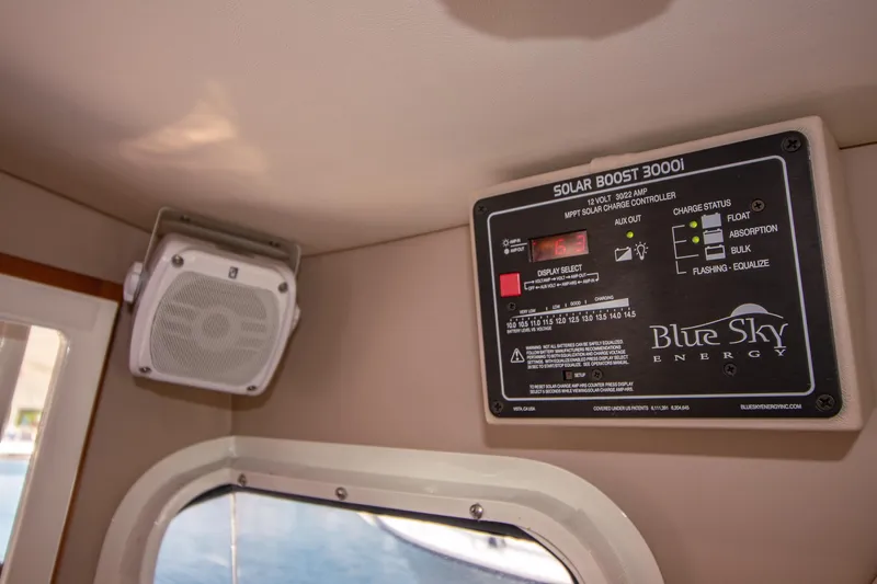 Arrow II Yacht Photos Pics Control panel and speaker inside Aspen C107, 2019 model, featuring Blue Sky Energy Solar Boost 3000i.