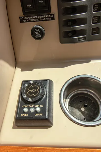 Arrow II Yacht Photos Pics Control panel of Aspen C107 boat, featuring ACR Point Pad and cup holder, 2019 model.