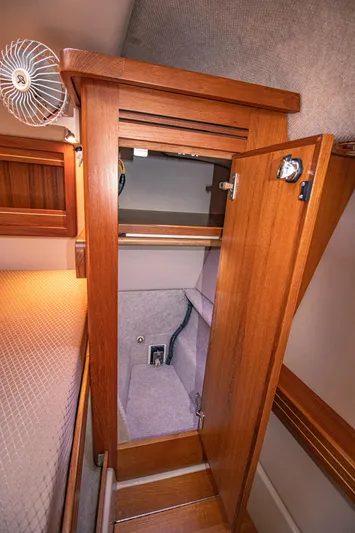 Arrow II Yacht Photos Pics 2019 Aspen C107 yacht interior with wooden closet and cozy cabin design.
