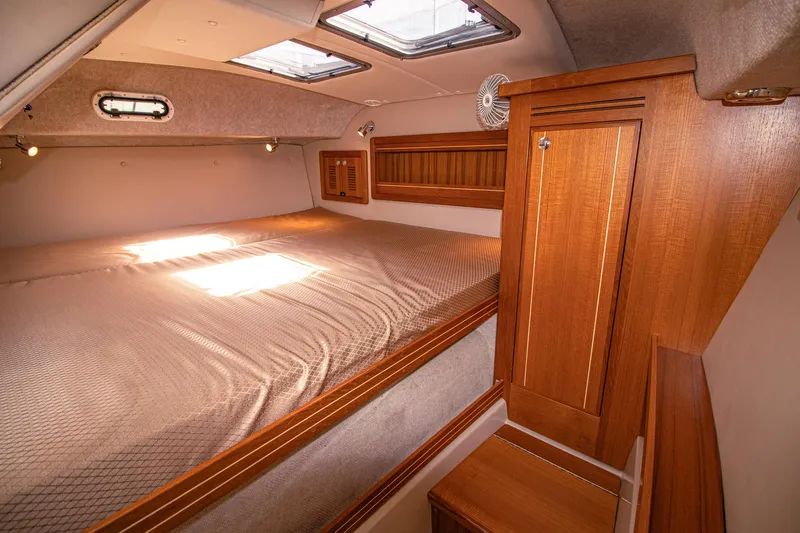 Arrow II Yacht Photos Pics 2019 Aspen C107 cabin interior with wooden cabinetry and skylights.