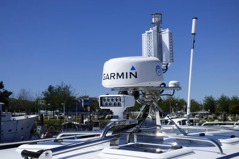 Arrow II Yacht Photos Pics Garmin radar on 2019 Aspen C107 boat, docked with clear blue sky background.