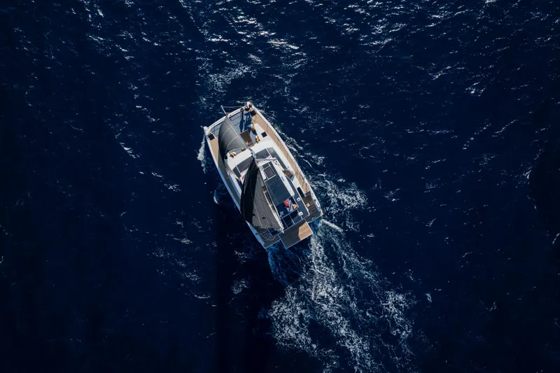  Yacht Photos Pics Aerial view of 2026 Bali 5.2 yacht sailing on deep blue ocean.