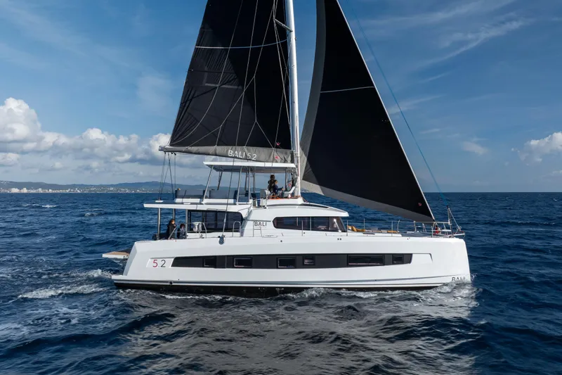  Yacht Photos Pics Sailing catamaran Bali 5.2, 2026 model, cruising on open sea under clear skies.