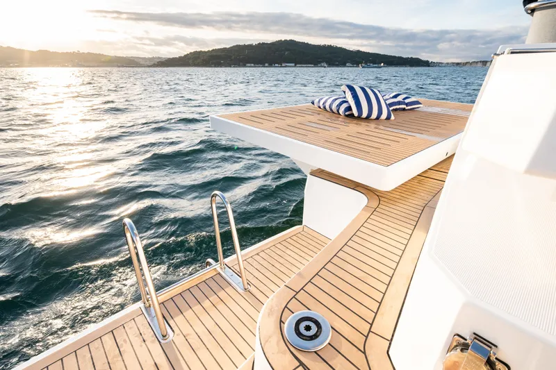  Yacht Photos Pics Luxurious Bali 5.2 yacht deck with striped cushions, ocean view, 2026 model.