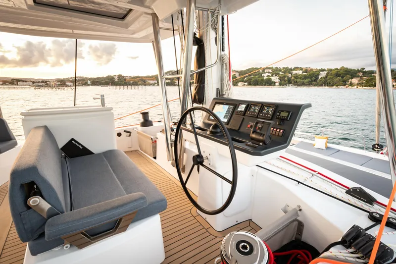  Yacht Photos Pics Helm of 2026 Bali 5.2 catamaran with modern controls and scenic ocean view.
