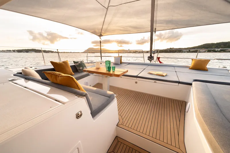  Yacht Photos Pics Luxurious Bali 5.2 yacht deck with comfortable seating, ocean view, and sunset ambiance, 2026 model.
