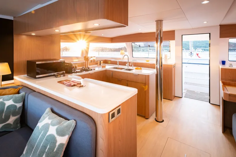  Yacht Photos Pics Luxurious interior of 2026 Bali 5.2 yacht with modern kitchen and sunset view.