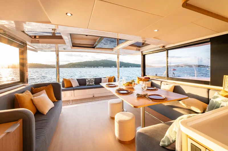  Yacht Photos Pics Luxurious interior of 2026 Bali 5.2 yacht with elegant dining area and ocean view.