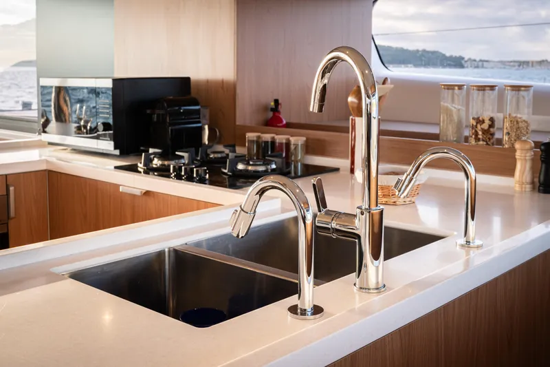  Yacht Photos Pics Modern kitchen on Bali 5.2 yacht, featuring sleek faucets and appliances, 2026 model.