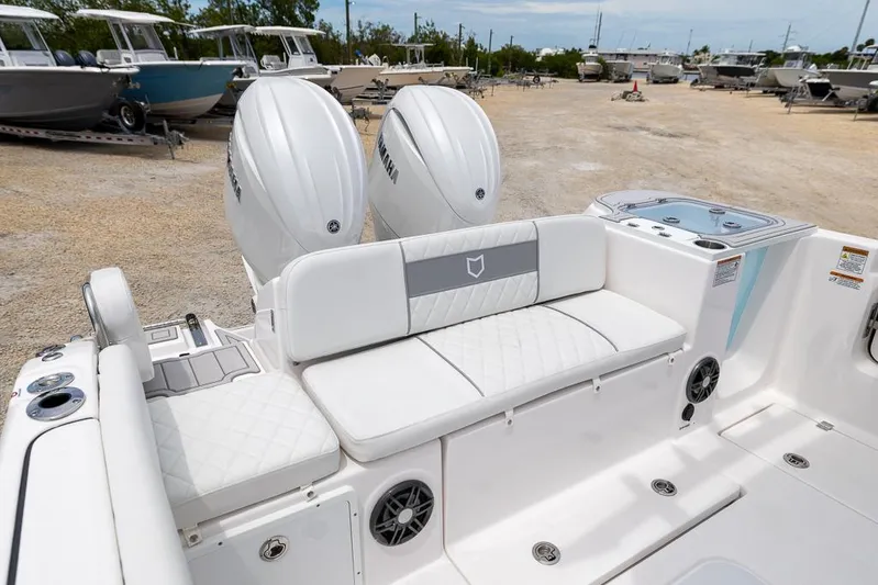  Yacht Photos Pics 2026 Sea Fox 268 Commander boat with dual Yamaha engines and white seating in a boatyard.