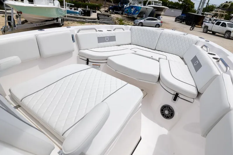  Yacht Photos Pics 2026 Sea Fox 268 Commander boat interior with white cushioned seating.