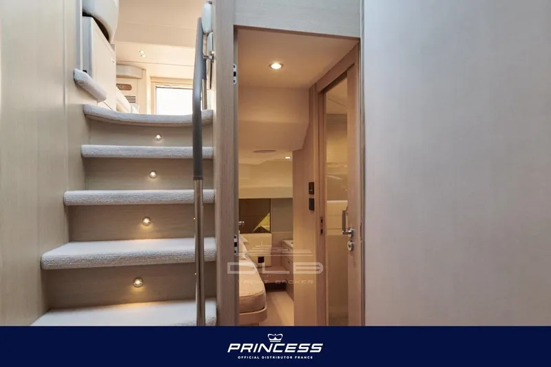 Yacht Photos Pics Interior view of 2023 Princess F50 yacht, featuring elegant staircase and modern design.