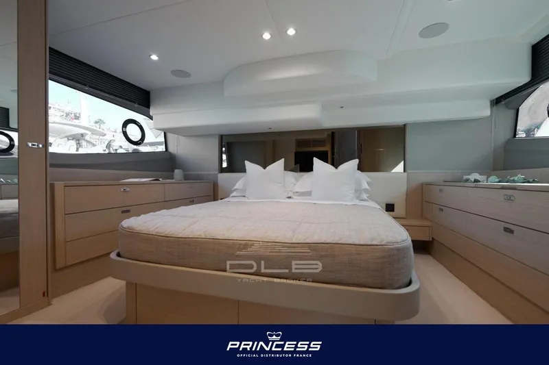  Yacht Photos Pics Luxurious interior of 2023 Princess F50 yacht featuring a spacious bedroom with modern design.