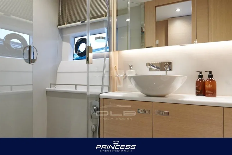  Yacht Photos Pics Luxurious bathroom interior of 2023 Princess F50 yacht with modern fixtures and elegant design.
