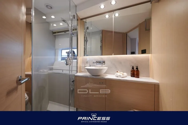  Yacht Photos Pics Luxurious bathroom interior of 2023 Princess F50 yacht with modern fixtures and elegant design.