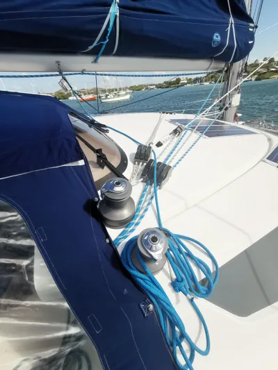 Think Twice Yacht Photos Pics 2005 Fountaine Pajot Lavezzi Maestro sailboat deck with blue rigging and winches.