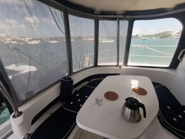 Think Twice Yacht Photos Pics Interior view of 2005 Fountaine Pajot Lavezzi Maestro catamaran with table and seating area.