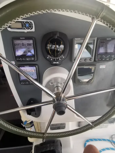 Think Twice Yacht Photos Pics Steering wheel and navigation instruments on 2005 Fountaine Pajot Lavezzi Maestro catamaran.