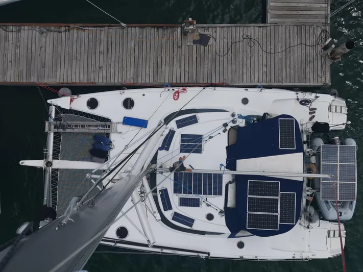 Think Twice Yacht Photos Pics Overhead view of 2005 Fountaine Pajot Lavezzi Maestro catamaran docked, featuring solar panels.