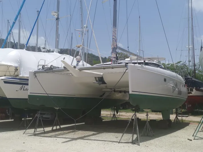 Think Twice Yacht Photos Pics 2005 Fountaine Pajot Lavezzi Maestro catamaran on stands in a boatyard.