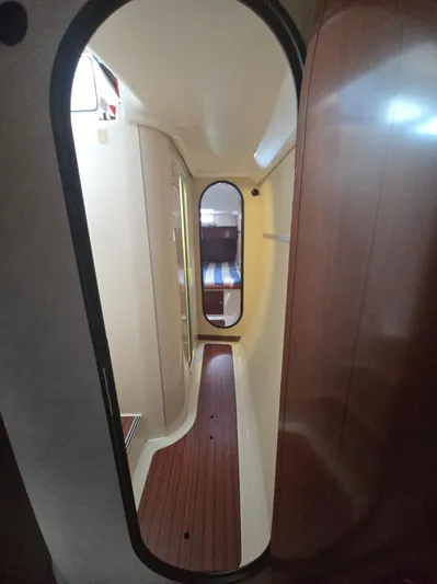 Think Twice Yacht Photos Pics 2005 Fountaine Pajot Lavezzi Maestro interior hallway with wood flooring and cabin view.