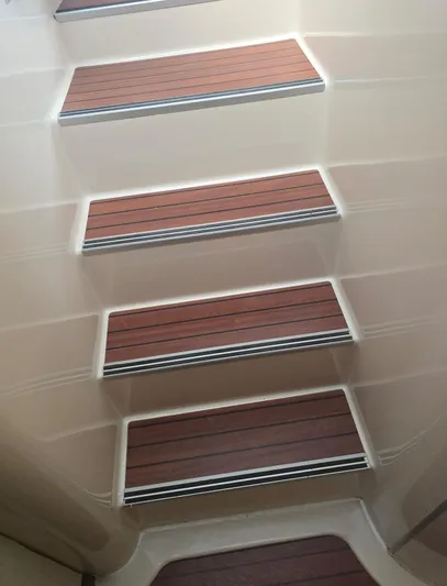 Think Twice Yacht Photos Pics Staircase with wooden steps on 2005 Fountaine Pajot Lavezzi Maestro yacht.