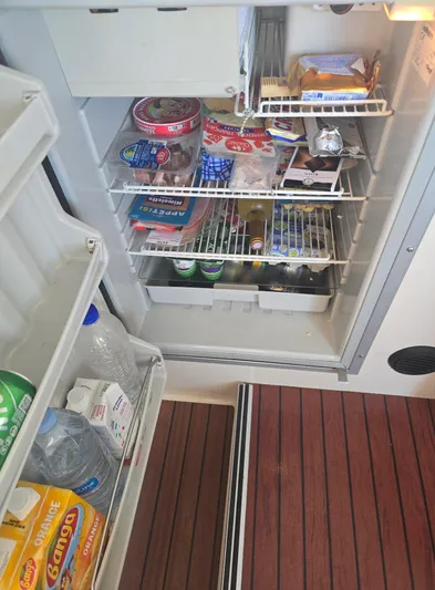 Think Twice Yacht Photos Pics Refrigerator stocked with food and drinks on 2005 Fountaine Pajot Lavezzi Maestro yacht.