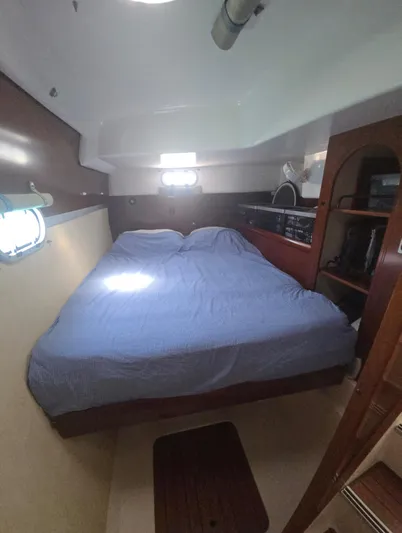 Think Twice Yacht Photos Pics 2005 Fountaine Pajot Lavezzi Maestro cabin with double bed and wooden interior.