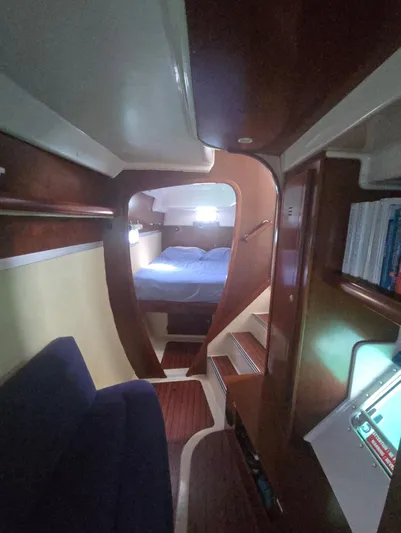 Think Twice Yacht Photos Pics Interior of 2005 Fountaine Pajot Lavezzi Maestro catamaran, featuring cozy cabin and wooden finishes.