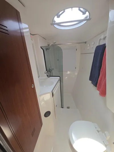 Think Twice Yacht Photos Pics 2005 Fountaine Pajot Lavezzi Maestro bathroom with shower, sink, and toilet.