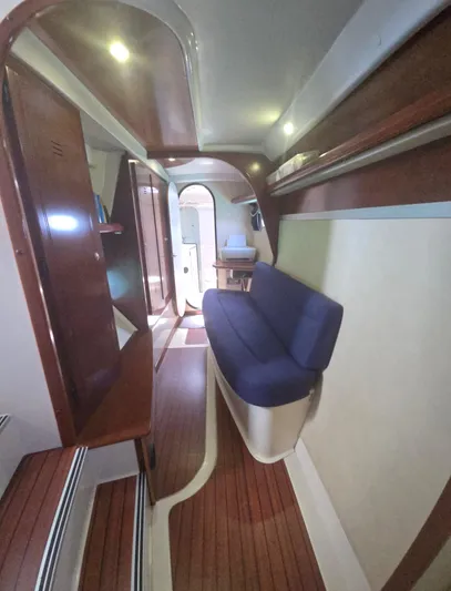 Think Twice Yacht Photos Pics Interior of 2005 Fountaine Pajot Lavezzi Maestro catamaran with wooden flooring and blue seating.