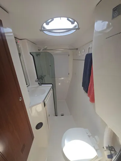 Think Twice Yacht Photos Pics 2005 Fountaine Pajot Lavezzi Maestro bathroom with shower, sink, and toilet.