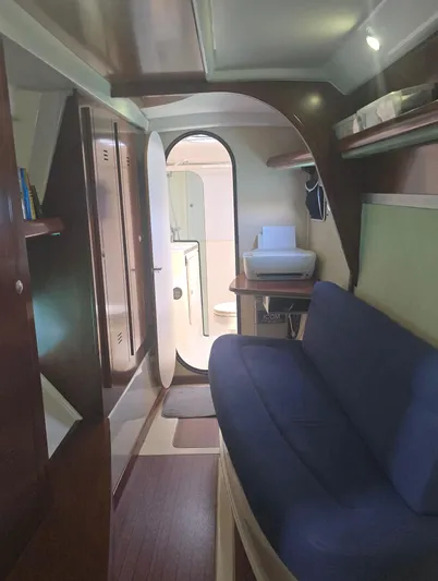 Think Twice Yacht Photos Pics Interior of 2005 Fountaine Pajot Lavezzi Maestro catamaran with blue seating and wooden finishes.