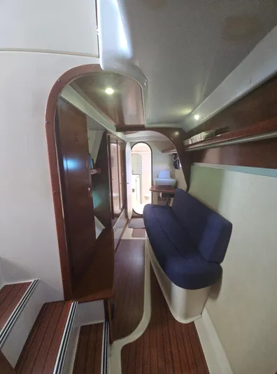 Think Twice Yacht Photos Pics Interior of 2005 Fountaine Pajot Lavezzi Maestro catamaran with wooden accents and blue seating.