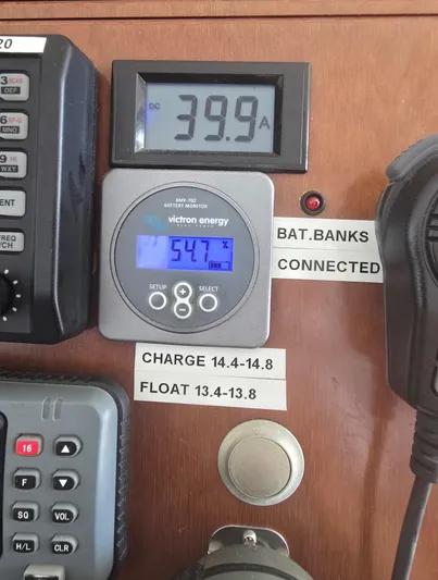 Think Twice Yacht Photos Pics Control panel of a 2005 Fountaine Pajot Lavezzi Maestro catamaran, displaying battery and charge information.