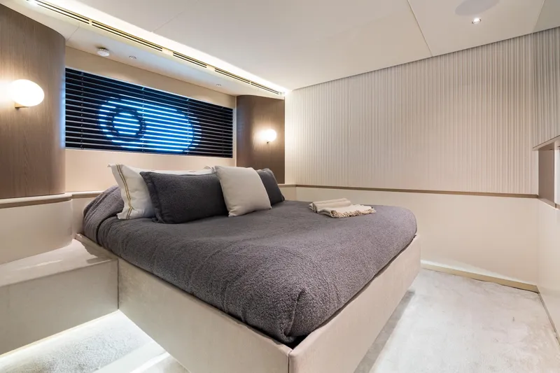 Life Yacht Photos Pics Luxurious bedroom interior on 2022 Azimut Magellano 25 Metri yacht, featuring modern design and cozy bedding.