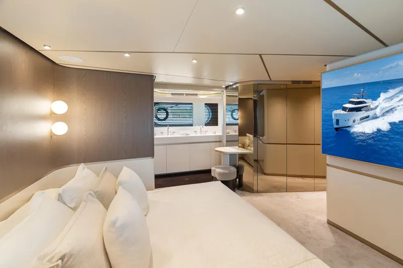 Life Yacht Photos Pics Luxurious bedroom interior of 2022 Azimut Magellano 25 Metri yacht with modern design elements.