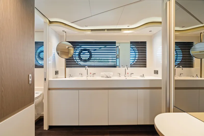 Life Yacht Photos Pics Luxurious bathroom interior of 2022 Azimut Magellano 25 Metri yacht, featuring modern design and fixtures.