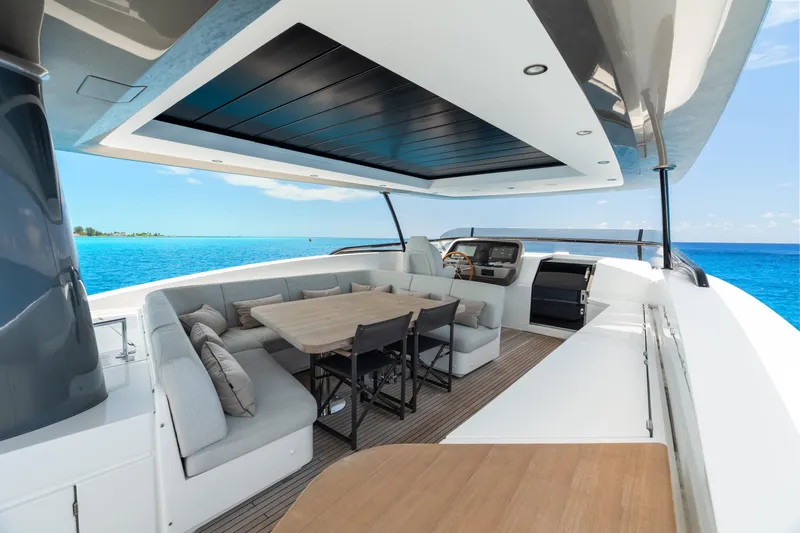 Life Yacht Photos Pics Luxurious 2022 Azimut Magellano 25 Metri yacht deck with elegant seating and ocean view.
