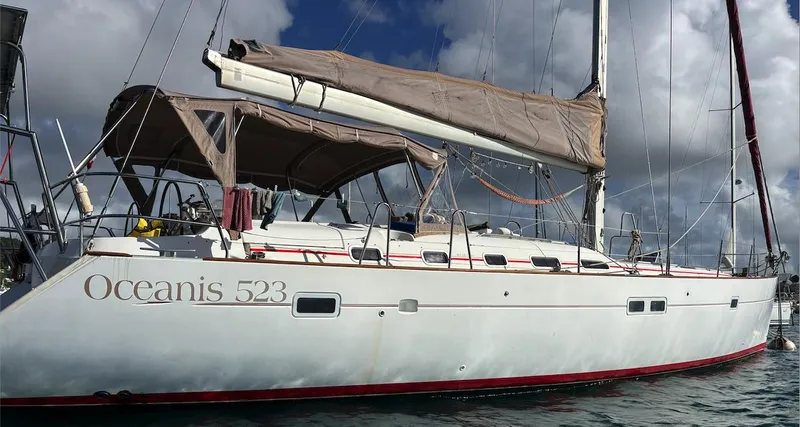 Magique 2 Yacht Photos Pics 2005 Beneteau Oceanis 523 sailboat docked under cloudy sky.