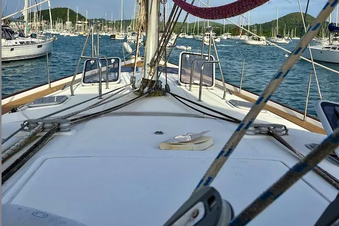 Magique 2 Yacht Photos Pics Deck view of a 2005 Beneteau Oceanis 523 sailboat in a marina.