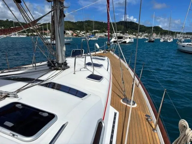 Magique 2 Yacht Photos Pics 2005 Beneteau Oceanis 523 sailboat on calm waters, showcasing sleek deck design.