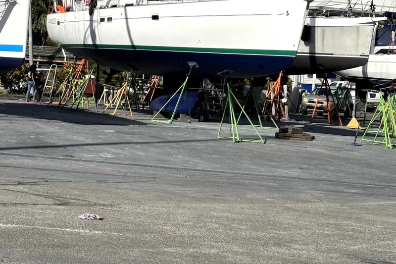 Magique 2 Yacht Photos Pics 2005 Beneteau Oceanis 523 sailboat on stands in a boatyard.